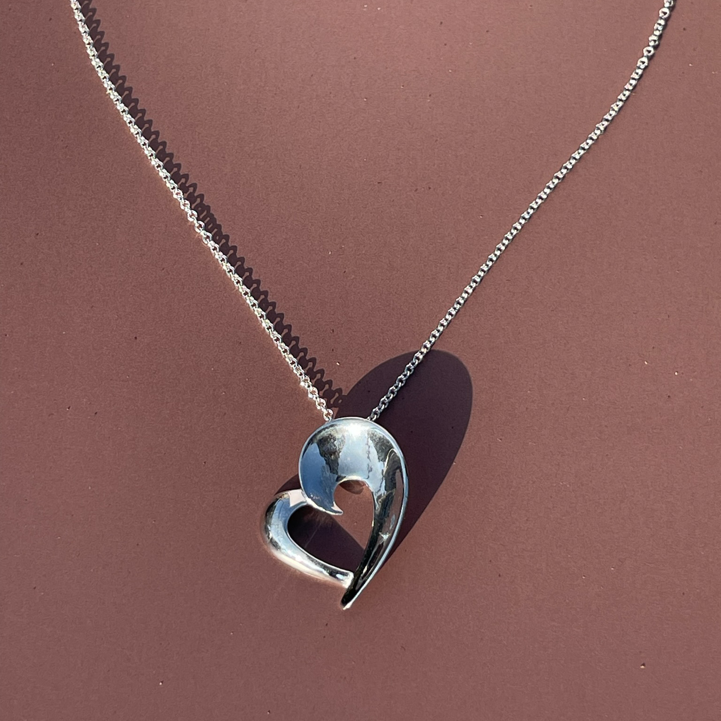 Rae's Silver Heart-Shaped Pendant
