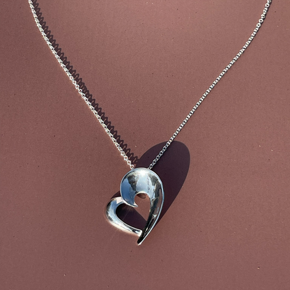 Rae's Silver Heart-Shaped Pendant